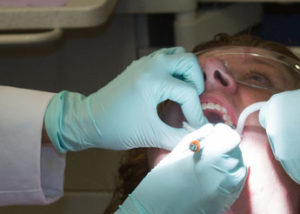 patient getting teeth examined