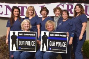 St. Louis Hills staff holding "we support our police" sings