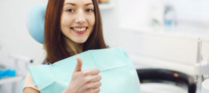 patient with giving a thumbs up